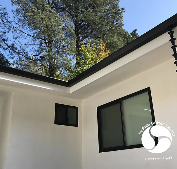 Malibu home with aluminum rain gutters and rain chain installation